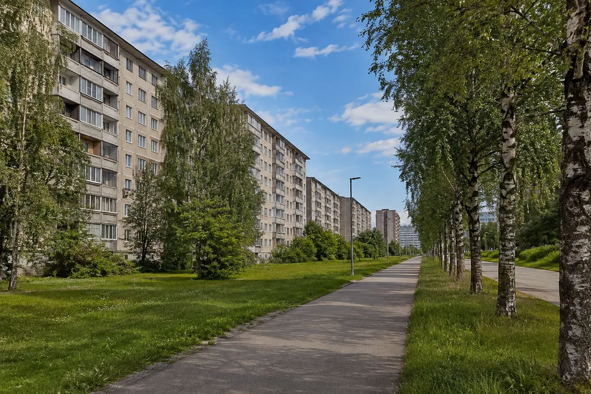 Illustrative image of a leafy urban route beside apartment buildings